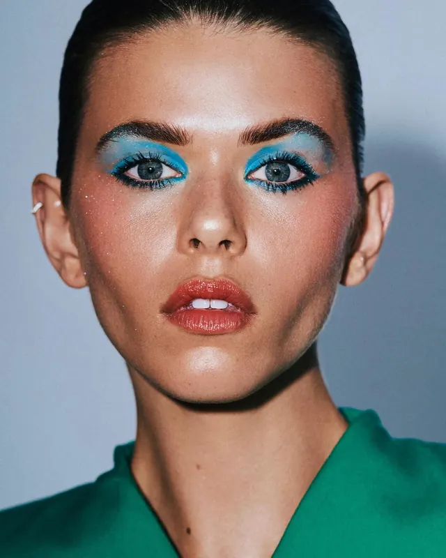Portrait of a Woman with Blue Eyeshadow, photographic, luxury, vibrant