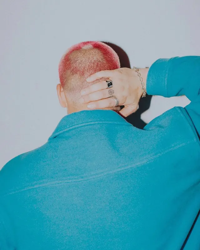 Portrait of a Person with Red Hair and Blue Sweater, photographic, minimal, vibrant