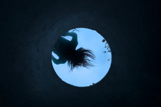 Silhouette in a Circular Portal, minimal, abstract, dark