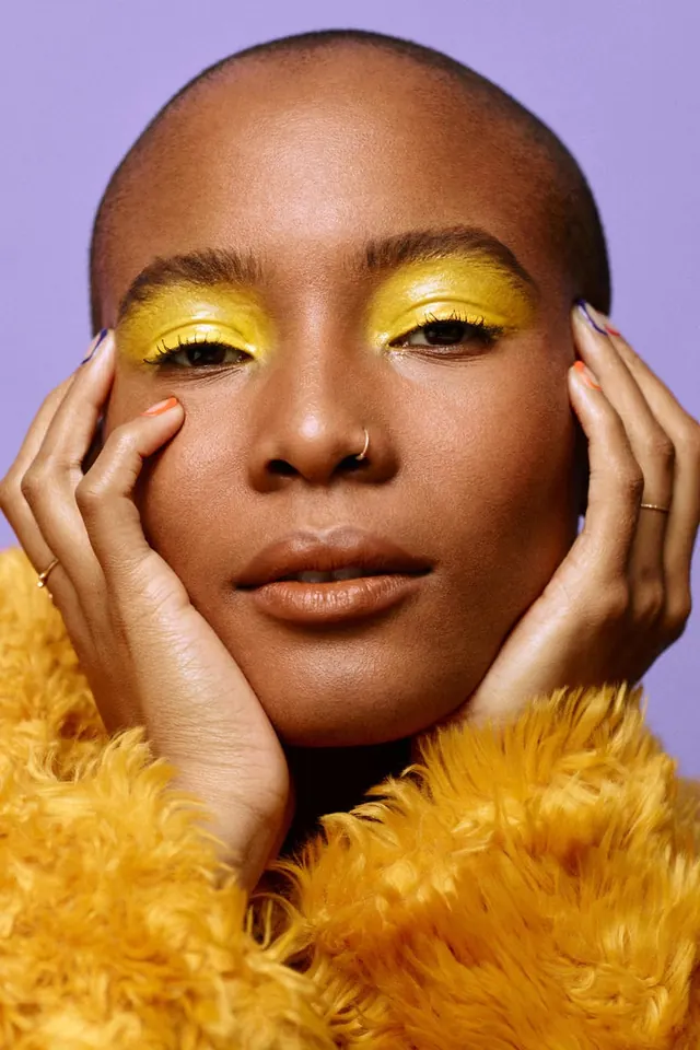 Portrait of a Woman with Yellow Eye Makeup, photographic, organic, vibrant