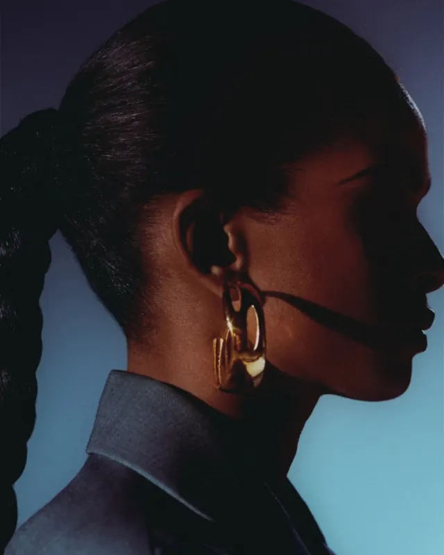 Profile of a Woman with Gold Earrings, photographic, luxury, dark