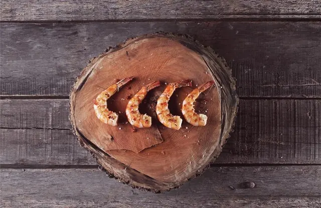 Wooden Log with Carved Wheat Design, organic, photographic, earthy