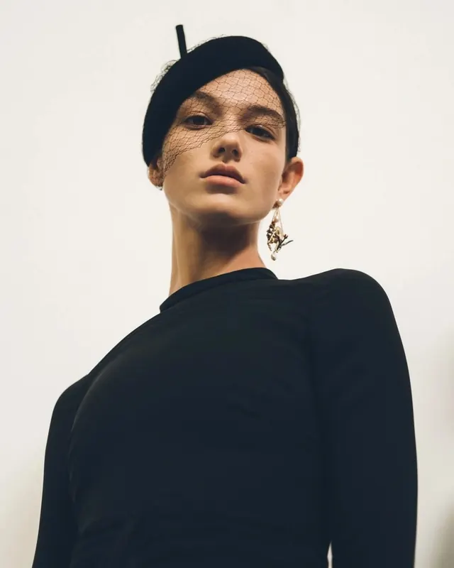 Fashion Portrait of a Woman in a Beanie, minimal, luxury, monochrome