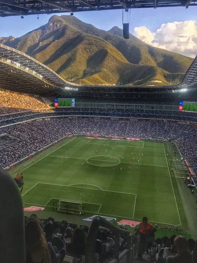 Stadium with Mountain Backdrop, photographic, vibrant