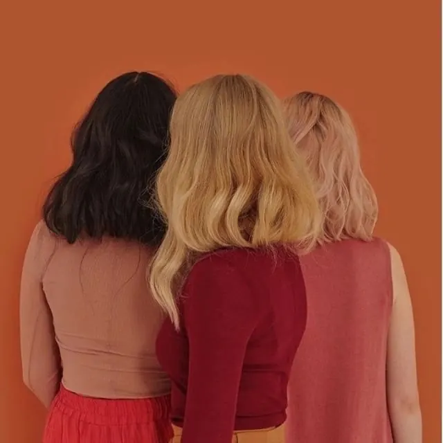 Three Women in Warm Tones, minimal, photographic, warm
