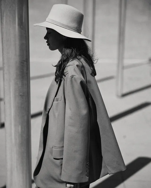Woman in Wide-Brimmed Hat and Trench Coat, minimal, monochrome, monochrome