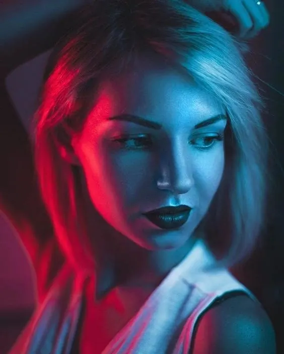Cyberpunk Portrait with Neon Lighting, photographic, dark-mode, high-contrast