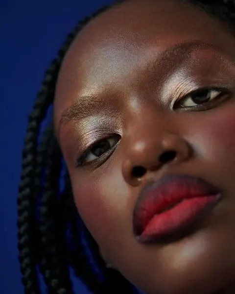 Close-up Portrait of a Woman with Red Lips, photographic, organic, vibrant