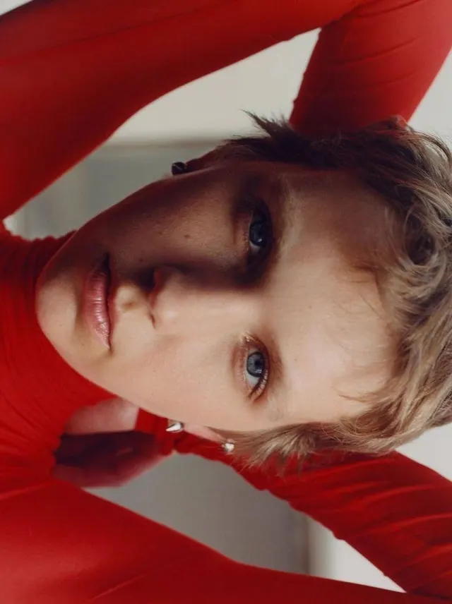Close-up Portrait of a Person in Red, photographic, minimal, vibrant