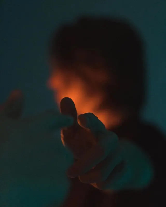 Glowing Hand Silhouette, photographic, dark-mode, dark