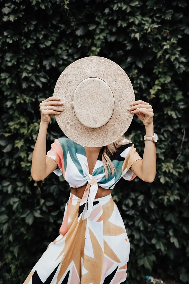Woman in Straw Hat and Patterned Dress, photographic, organic, vibrant