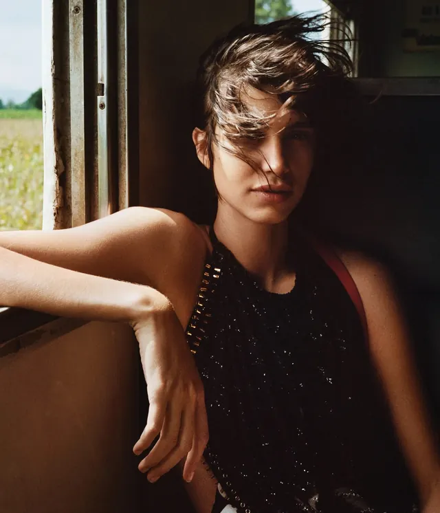 Portrait of a Woman in a Window, photographic, editorial, dark