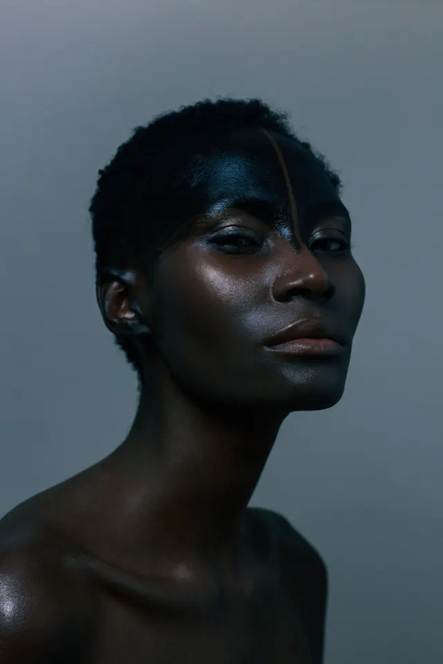 Portrait of a Person with Face Paint, photographic, minimal, dark