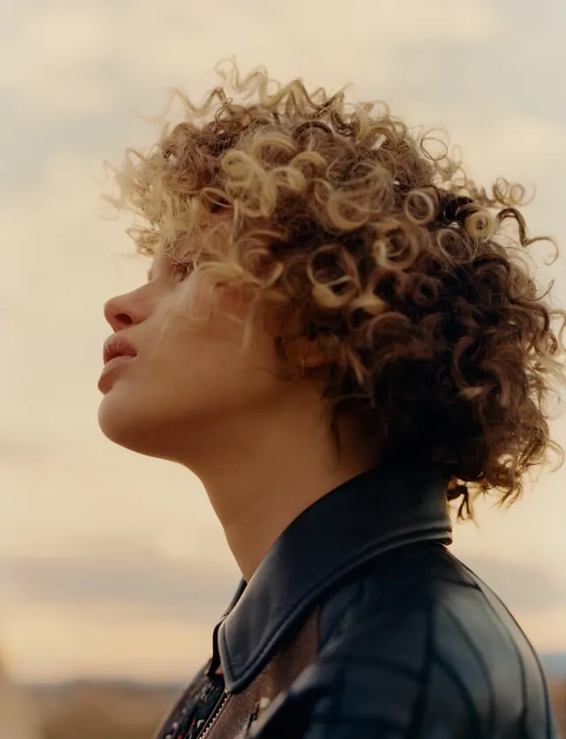 Portrait of a Person with Curly Hair, photographic, organic, warm