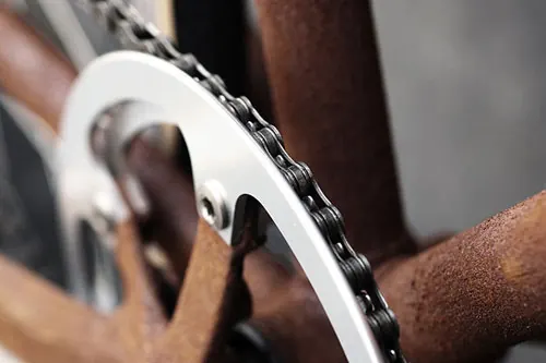 Close-up of a Bicycle Chain and Sprocket, photographic, technical, monochrome