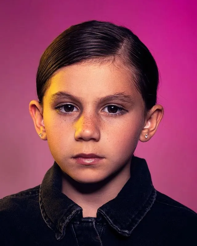 Portrait of a Boy with Slicked Hair, photographic, vibrant