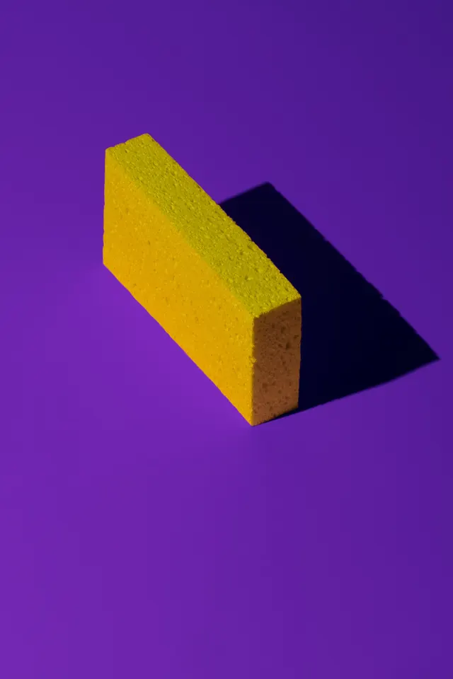 3D Yellow Rectangular Block on Purple Background, minimal, geometric, vibrant
