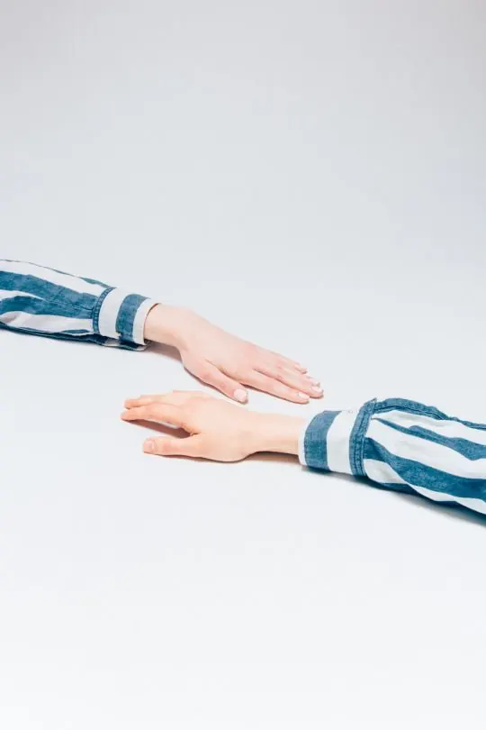 Close-up of Hands in Blue and White Striped Sleeves, minimal, photographic, light