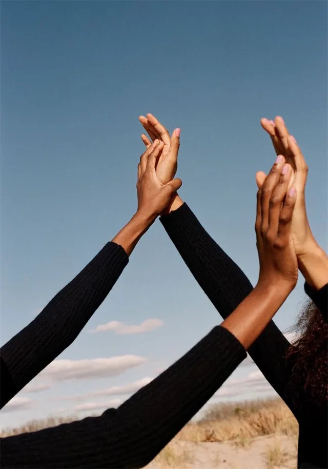 Intertwined Hands reaching for the Sky, minimal, photographic, high-contrast