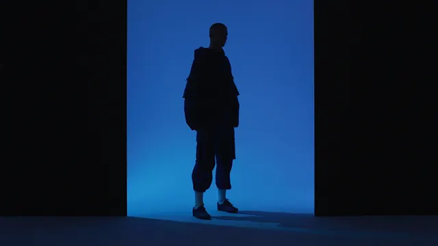 Silhouette Figure Against Blue Background, minimal, photographic, vibrant
