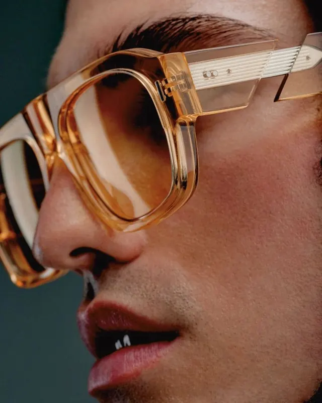 Close-up of Person Wearing Orange Tinted Sunglasses, photographic, luxury, warm