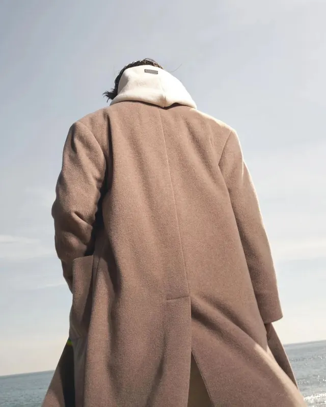 Person in Oversized Coat, minimal, photographic, muted