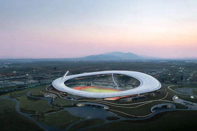 Aerial View of a Stadium at Sunset, photographic, minimal, warm