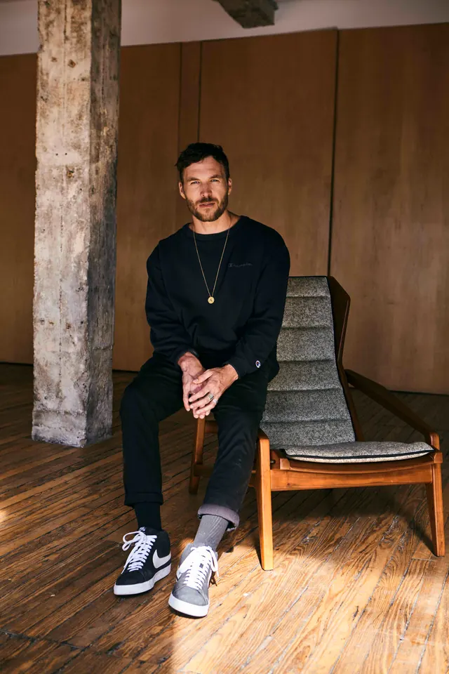 Man in Streetwear with Sneakers, photographic, minimal, dark