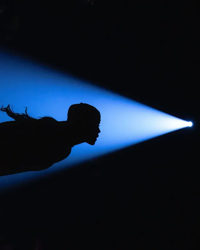 Silhouette in Light Beam, minimal, dark-mode, dark