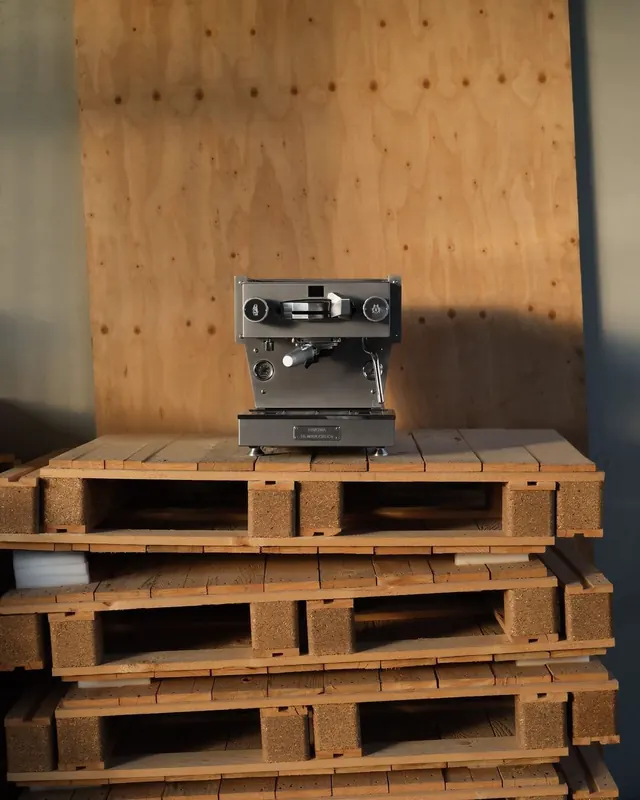 Industrial Espresso Machine on Wooden Pallets, minimal, technical, earthy