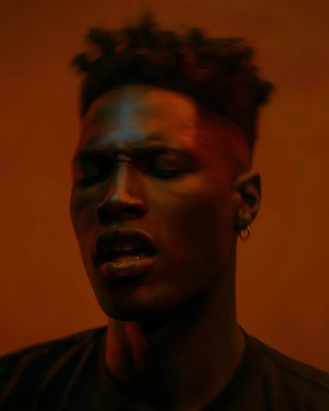 Portrait with Orange Lighting, photographic, dark-mode, warm