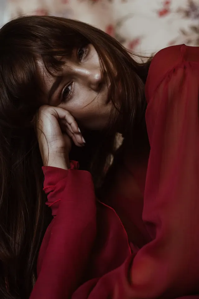 Portrait of a woman in red, photographic, organic, vibrant