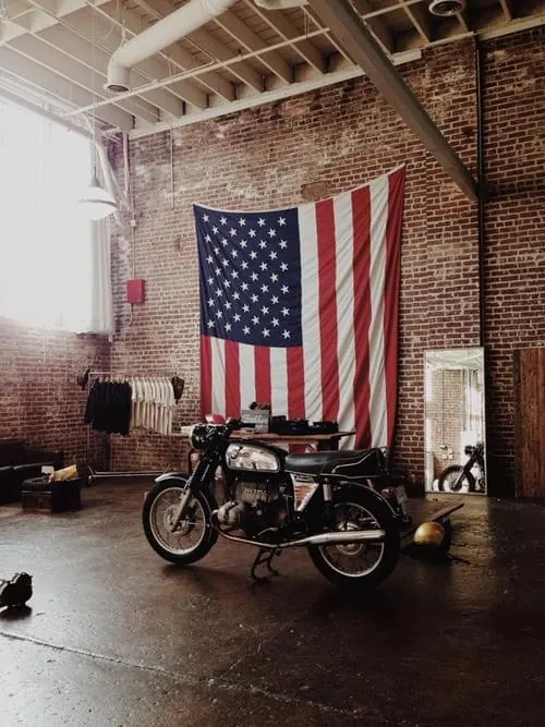 Motorcycle in Industrial Space, photographic, retro, dark