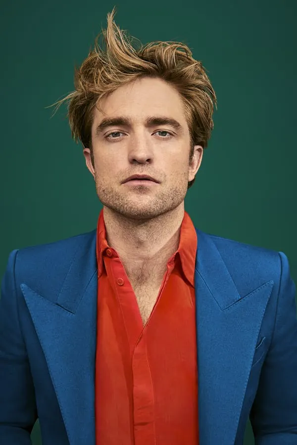 Portrait of a man in blue and orange attire, photographic, vibrant