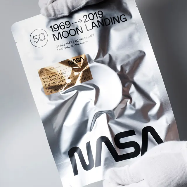 NASA Moon Landing Commemorative Packaging, minimal, corporate-clean, light