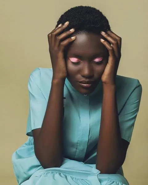 Portrait of a person with red eyes, minimal, photographic, high-contrast