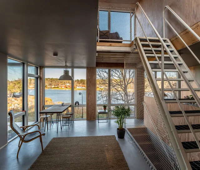 Modern Industrial Interior with Waterfront View, minimal, light-mode, warm