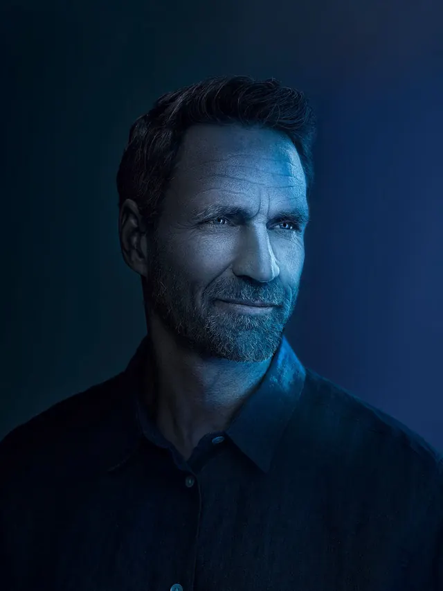 Portrait of a Man in Blue Lighting, photographic, dark-mode, dark