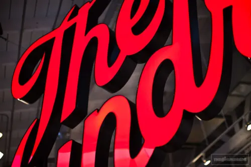 Red Script Typography on Glass, minimal, monochrome, high-contrast