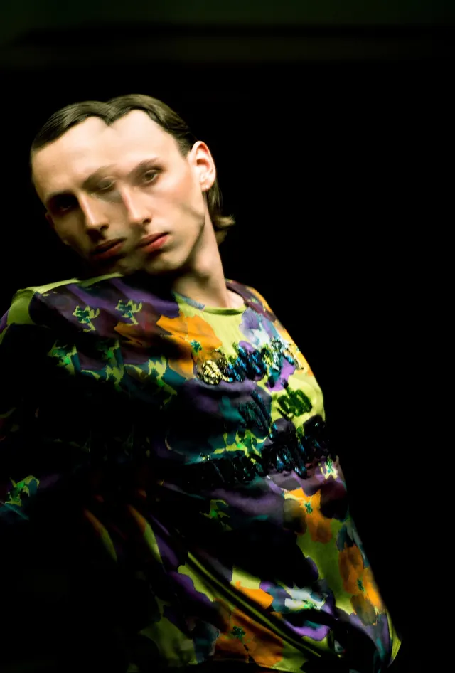 Portrait of a Person in Patterned Garment, photographic, maximalist, dark