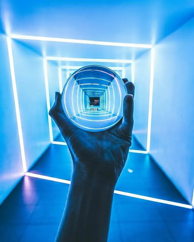 Glowing Holographic Sphere in Hand, dark-mode, glassmorphism, dark