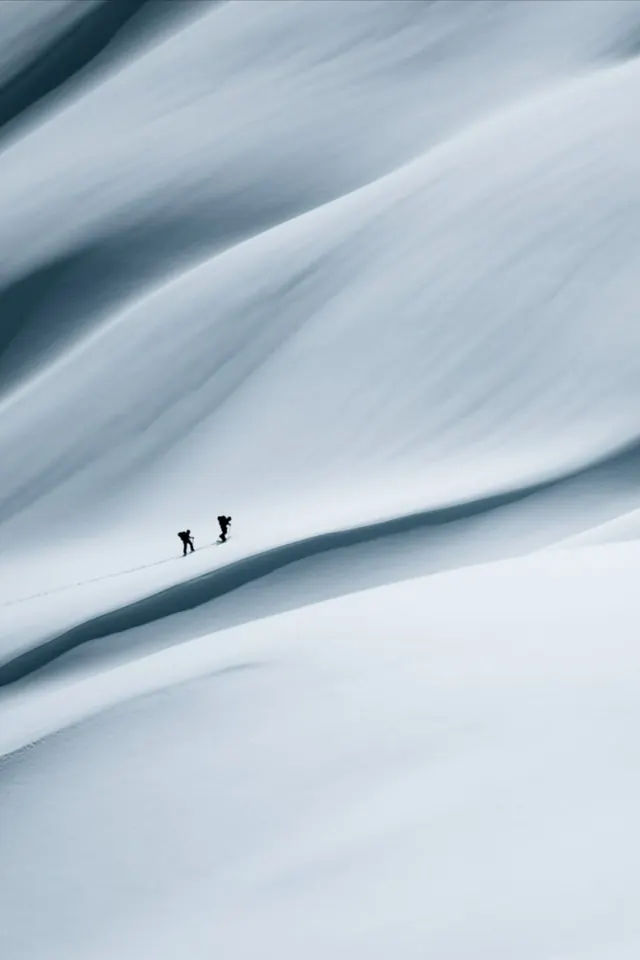 Aerial climbers on snowy slope, minimal, monochrome, light