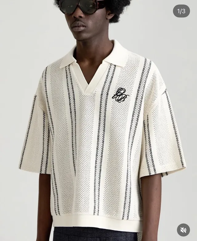 Cream textured knit polo with vertical stripe detail, minimal, photographic, light