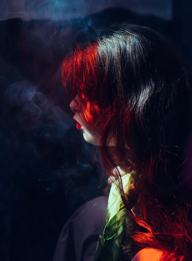 Cinematic Portrait with Red and Blue Lighting, photographic, dark-mode, high-contrast