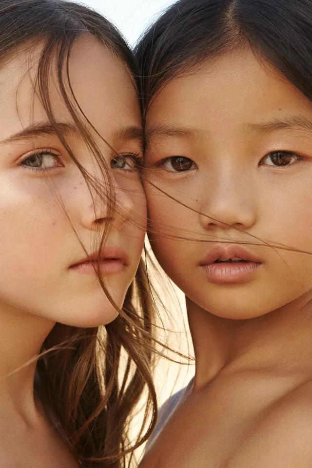 Close-up Portrait of Two Women, photographic, minimal, warm