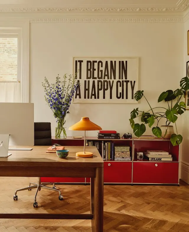 Mid-century office interior with typographic poster, photographic, editorial, warm