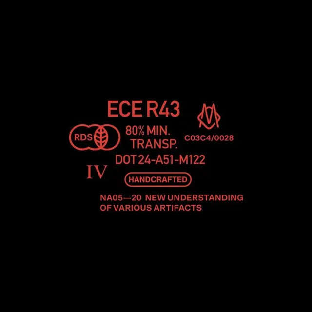 Technical code system in red on black with handcrafted badge, minimal, technical, dark