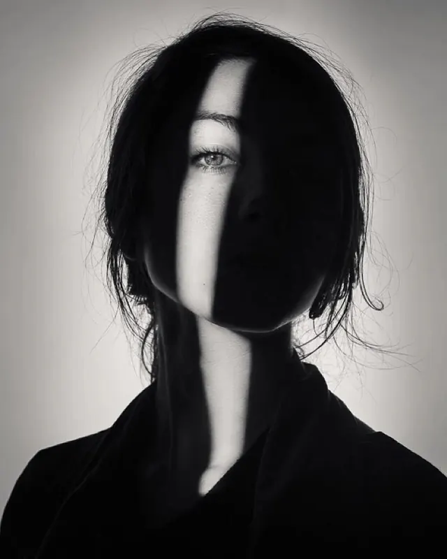 High-Contrast Portrait with Shadow Play, monochrome, minimal, monochrome