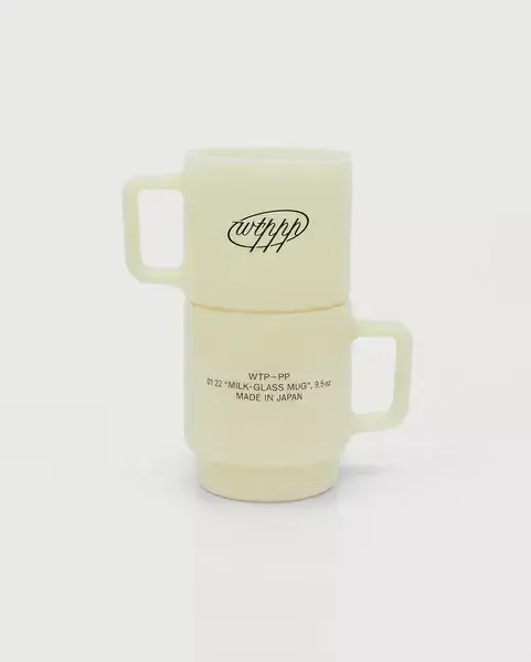 Translucent cream pottery mug with script logo, minimal, organic, light