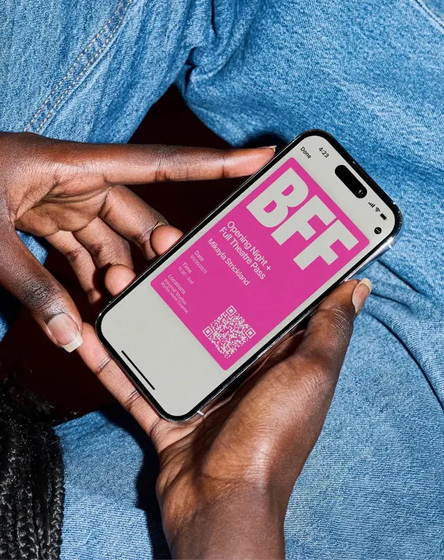 Hands-on pink phone mockup with blue denim, photographic, gradient-heavy, vibrant
